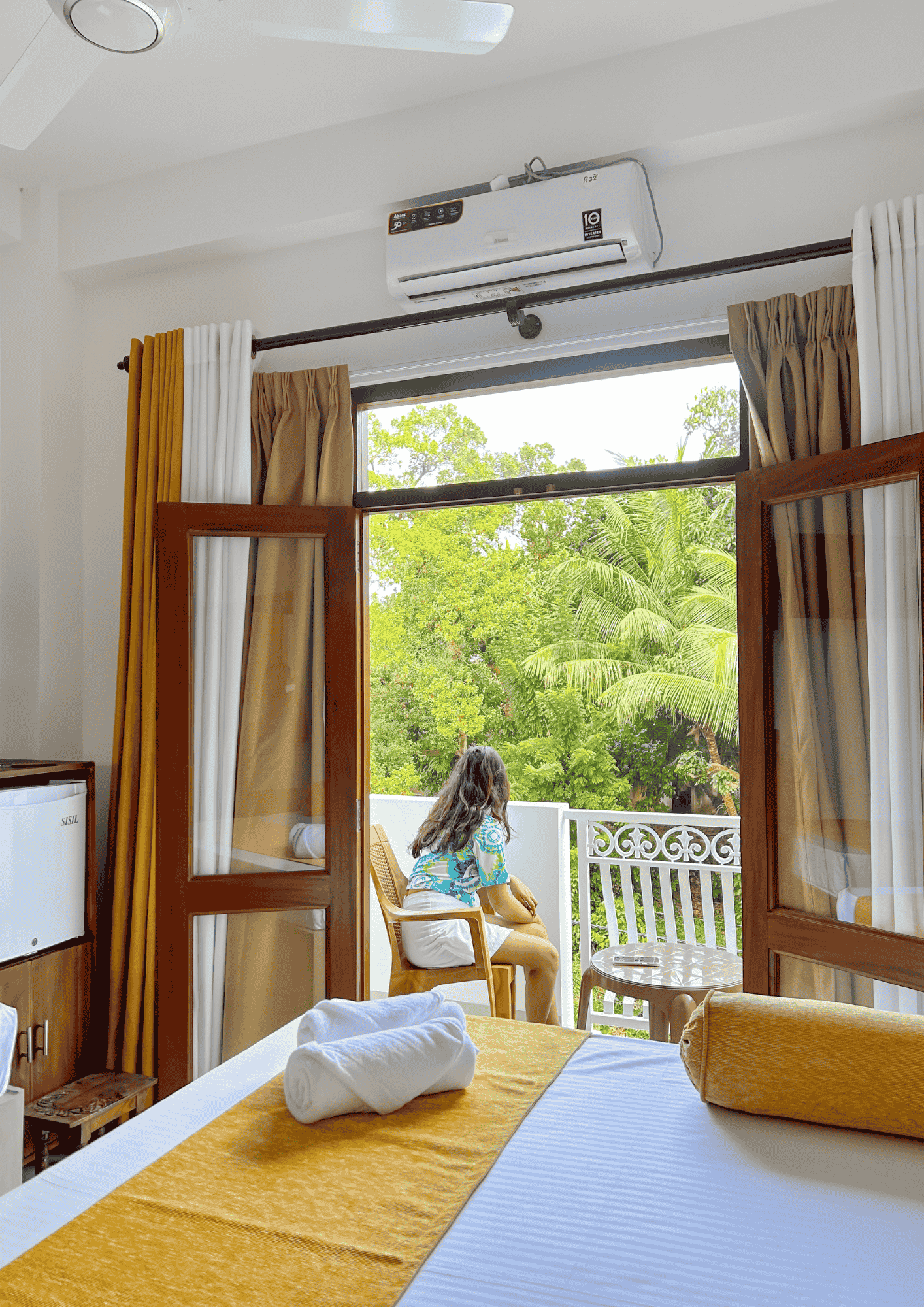 Woman sitting outside the room